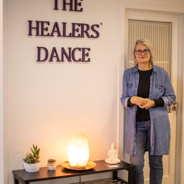 Margot Ussher beside The Healers’ Dance sign
